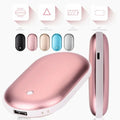 Chauffe-mains rechargeable USB en forme d'œuf tenu dans une main